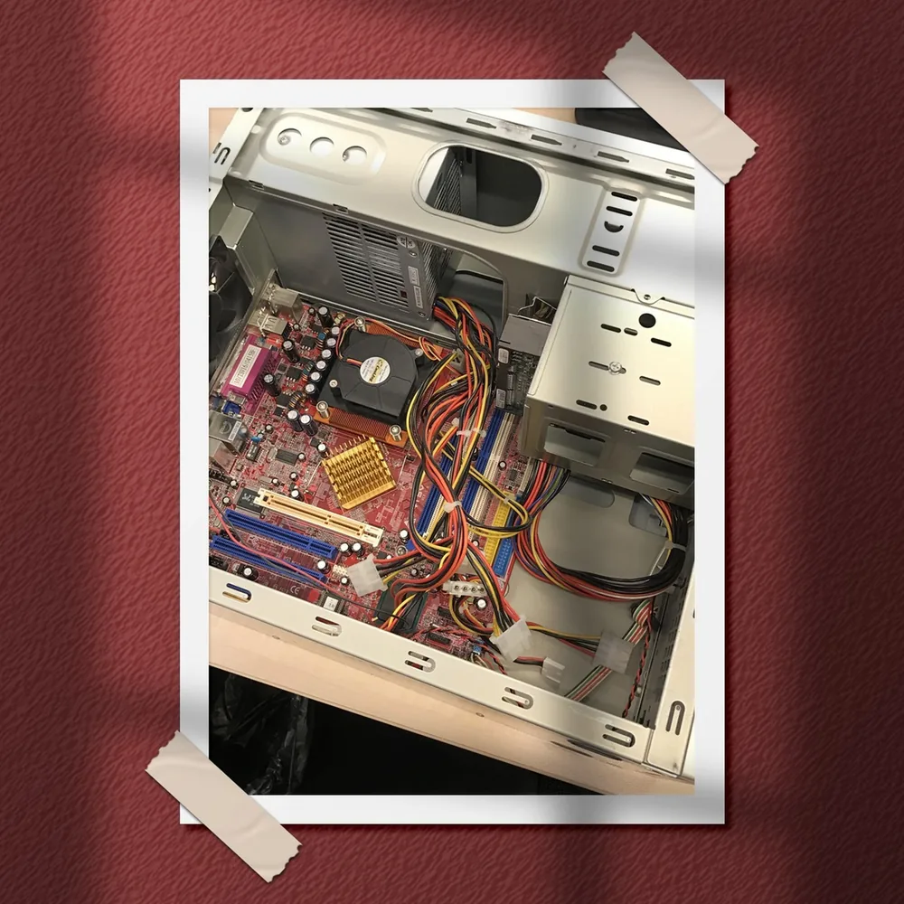 Our first server: an open PC tower with its motherboard and cables