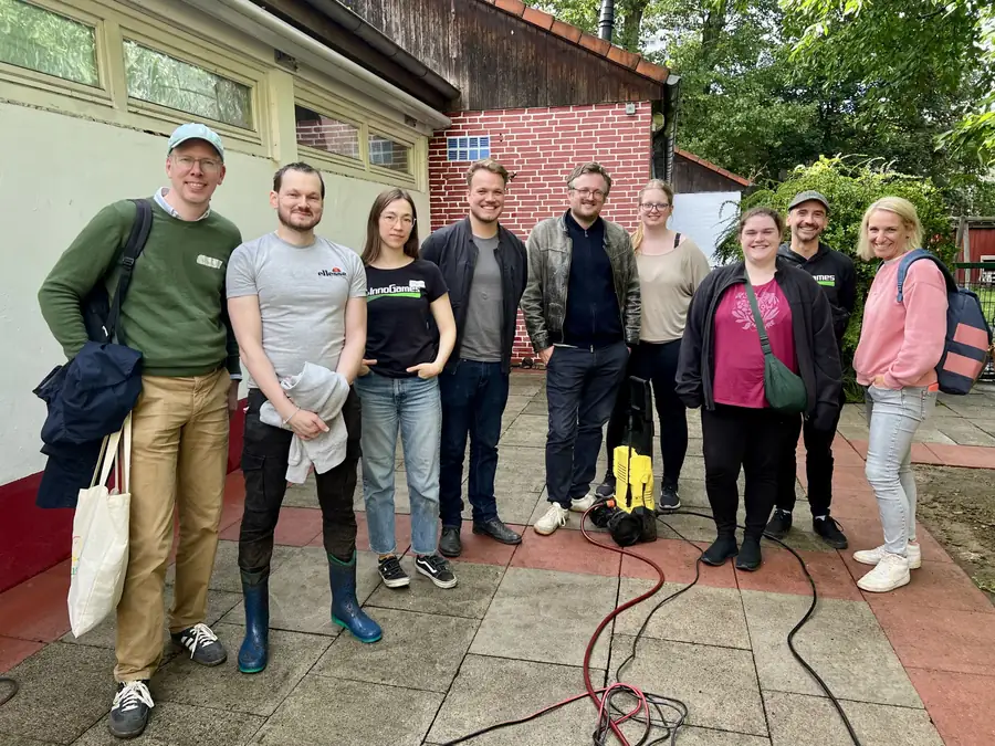 One of the Social Day teams in front of the building they worked on